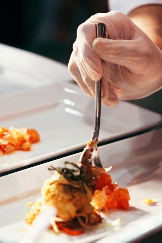 Chef preparing plated meals 